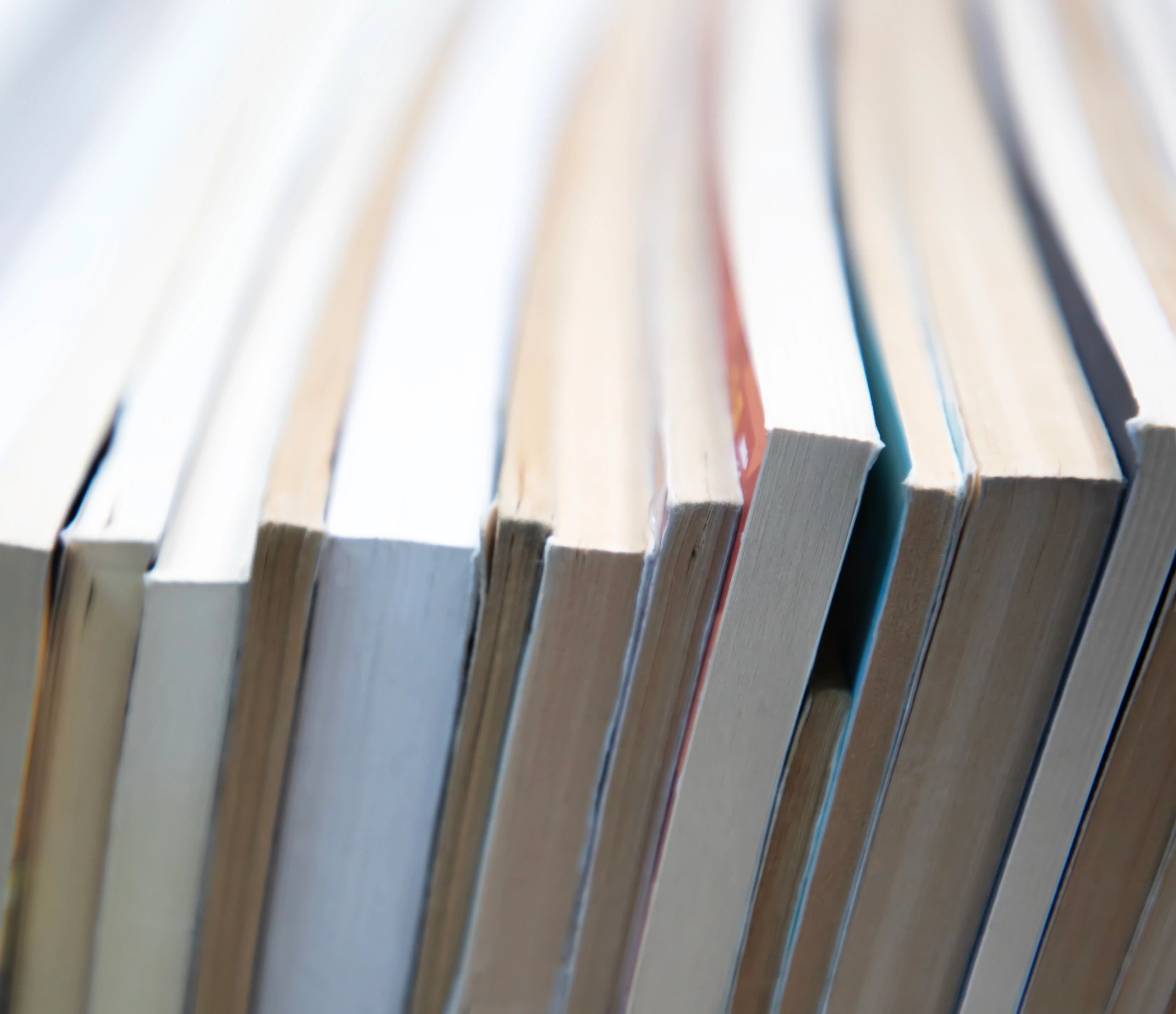 Stack of books for writing craft inspiration